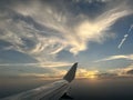 The wing of a commercial airline airplane while flying high in the sky over Dallas Texas on a travel vacation Royalty Free Stock Photo