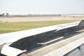 wing on commercial plane landing on Suvarnabhumi airport