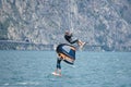 Wing-foil surfer with other surfers on the Lake Garda, Italy. Royalty Free Stock Photo