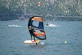 Wing-foil surfer with other surfers on the Lake Garda, Italy. Royalty Free Stock Photo