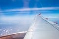 Wing of jet commercial aircraft through window