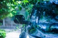 Black car under the tree with rain drop water Royalty Free Stock Photo