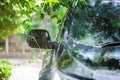 Black car under the tree with rain drop water Royalty Free Stock Photo