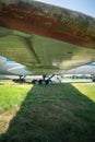 The wing of the plane. Hull, chassis, engines and propellers of an old plane. large, cargo, military aircraft with a large payload