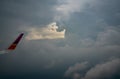 Wing of plane over the city. Airplane flying on blue sky. Scenic view from airplane window. Commercial airline flight Royalty Free Stock Photo