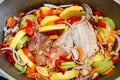 The wing of turkey with colourful vegetables. Raw meat before cooking. Poultry dishes. Potatoes, pepper, zucchini and onion in the Royalty Free Stock Photo