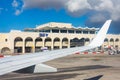 Wing view airplane to the main building of Malta International Airport Maltese Islands.. Luqa, Malta 14 May, 2019