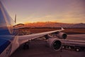 Wing view of a Boeing 747 parked at Quito Airport during sunset with fuelling truck..Quito, Ecuador - 13/09/2015