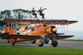 Wing walking display with Boeing Stearman biplanes.