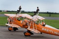 Wing walking display with Boeing Stearman biplanes. Royalty Free Stock Photo