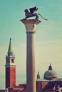 Winged lion on marble column in Venice, Italy.