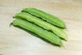 Winged Bean or Princess Bean on wooden chopping block