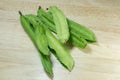 Winged Bean or Princess Bean on wooden chopping block