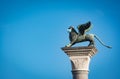 Venice`s symbol, the winged lion statue with a surgical mask