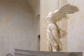 Winged Victory of Samothrace or the Nike of Samothrace sculpture on the middle of the staircas i The Louvre museum