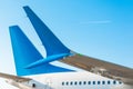 Winglets wings of the aircraft`s tail and fuselage against the blue sky with the airplane on the flight level. Royalty Free Stock Photo