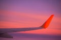 Wings Airplane with sky pastel sunset. flight view from window airplane