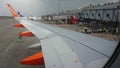 Wings of Easy Jet Airplane at Schiphol International Airport, in the Netherlands