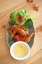 Wings fied chicken on dish in thai menu Royalty Free Stock Photo