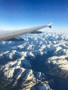 Wings of plane above mountains Royalty Free Stock Photo