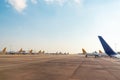 Wings and tails of Comercial airplanes parking at the airport and preparing for flight. Transportation concept. Royalty Free Stock Photo