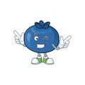 Wink cartoon funny blueberry fruit with mascot