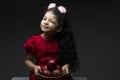 Winked eye girl with pomegranates basket in front of her Royalty Free Stock Photo