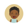 Winking Afro American child. Playful African toddler emoticon. Cute dark-skinned baby facial expression.