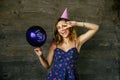 Happy woman celebrating her birthday, showing peace sign