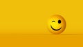 Winking emoji face isolated on yellow background with copyspace Royalty Free Stock Photo