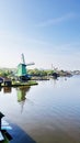Winmills by a lake in Zaanse Schans, the Netherlands