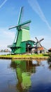 Winmills by a lake in Zaanse Schans, the Netherlands