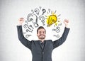 Winner businessman, question marks and light bulbs Royalty Free Stock Photo