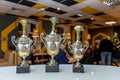 Winner or champion gold trophy cup with abstract dark blurred background. Victory first place of competition. Winning or Royalty Free Stock Photo