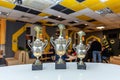 Winner or champion gold trophy cup with abstract dark blurred background. Victory first place of competition. Winning or Royalty Free Stock Photo