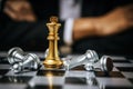 Winner. golden king with silver chess piece on chess board game competition on business man background Royalty Free Stock Photo