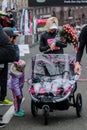 The winner of the marathon fixes the finish time. Woman athlete looks at the clock. The winner of the race meets her daughter