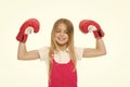 Winner takes it all Child ambitious likes win and success. Girl on smiling face posing with boxing gloves as winner