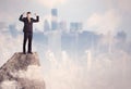 Winner urban businessman on top of stone Royalty Free Stock Photo