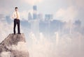 Winner urban businessman on top of stone Royalty Free Stock Photo