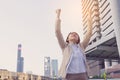 Winner woman celebrating success on city background Royalty Free Stock Photo