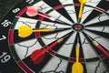 Winner yellow dart arrow hit center target of dartboard and other arrow loser metaphor marketing competition concept, on Royalty Free Stock Photo