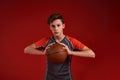 Winners never quit and quitters never win. A teenage boy engaged in sport, looking at camera and holding basketball Royalty Free Stock Photo
