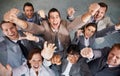 Winners. Top view of a group of young business executives celebrating together. Royalty Free Stock Photo