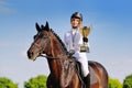 Winners - young girl and bay horse Royalty Free Stock Photo
