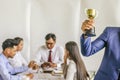 Winning business team gold trophy , business team happy consent Royalty Free Stock Photo