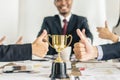 Winning business team gold trophy , business team happy Royalty Free Stock Photo