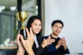 Winning business team gold trophy , business team happy Royalty Free Stock Photo