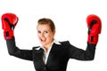 Winning business woman wearing boxing gloves Royalty Free Stock Photo