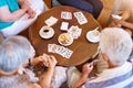 Winning through a combination of luck and skill. High angle shot of a group of seniors playing cards around a table in Royalty Free Stock Photo